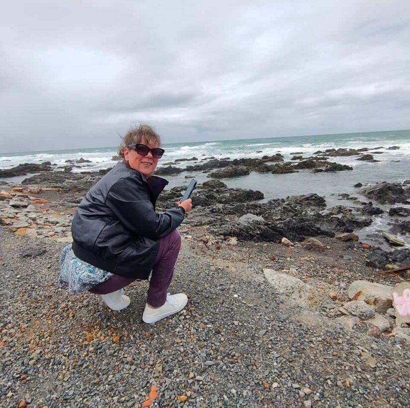 A photo of Michelle, the creator of Eco TIGA in her happy place at the beach