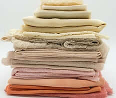 Pile of folded natural fabrics